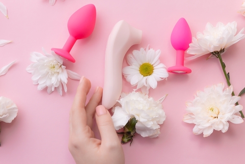 Curated sexual wellness products styled on a soft background